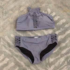 Dark blue or gray two piece swim suit.